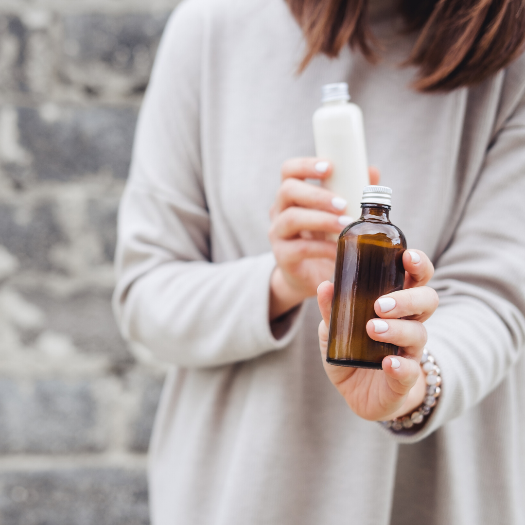 Amber Glass Bottles in Hand